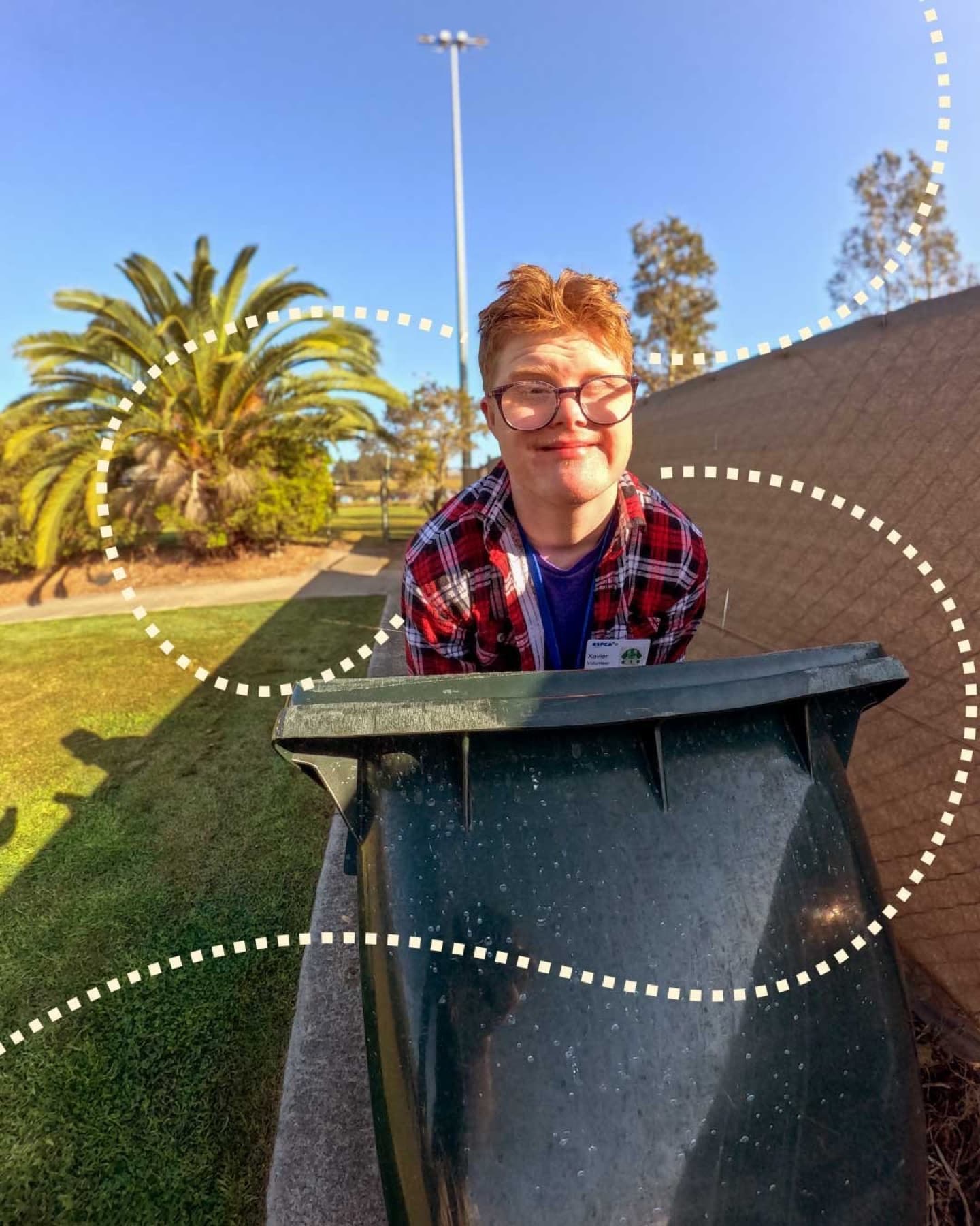 Xavier on the job, taking out the bins, building real independence.